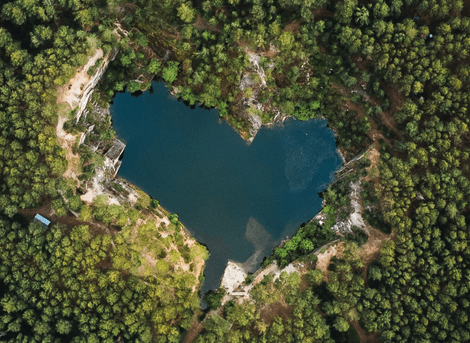 Heart shaped lake in a forest.
