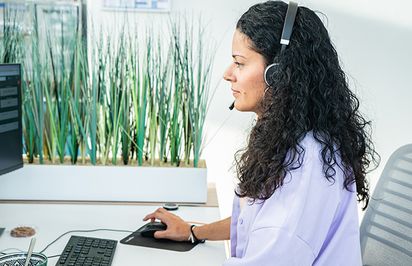 Staffmatch team member helping a customer on the phone.