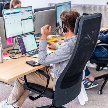 A Staffmatch collaborator on the phone with a candidate.